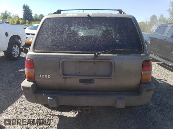 1995 Jeep Grand Cherokee Laredo with VIN 1J4FX58S1SC754691, listed as a Copart auction lot 72858214 with 251,234 mi miles and Salvage Title. Bid and sale history available at carsss.com. Image 6.