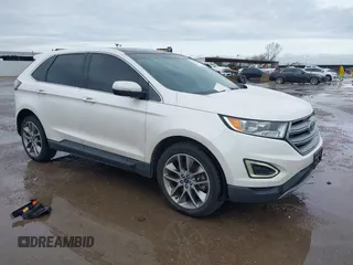 2015 Ford Edge Titanium z VIN 2FMTK3K82FBC42299, wystawiony jako IAAI lot #41912657 z przebiegiem 198 144 mil mil oraz . Historia ofert i sprzedaży dostępna na DreamBid. Obrazek 1.