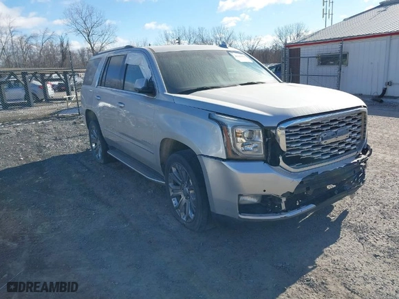 2016 GMC Yukon Denali with VIN 1GKS2CKJ1GR291872, listed as a IAAI auction lot 41169434 with 137,009 mi miles. Bid and sale history available at carsss.com. Image 1.