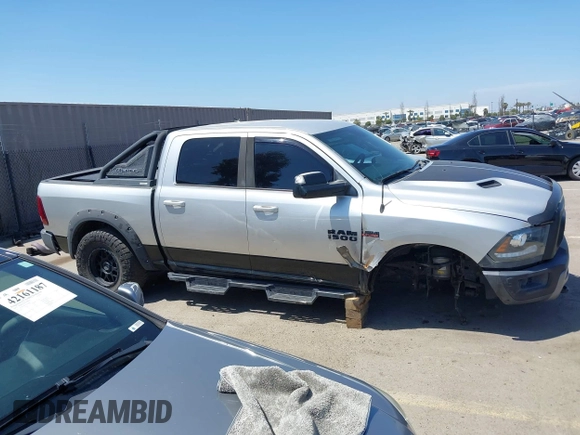2016 Ram 1500 Rebel z VIN 1C6RR7YT5GS251994, wystawiony jako IAAI lot #42139378 z przebiegiem 102 736 mil mil oraz . Historia ofert i sprzedaży dostępna na DreamBid. Obrazek 13.