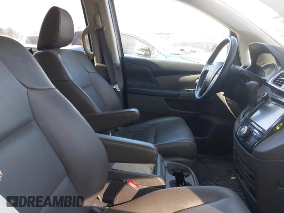 2014 Honda Odyssey Touring with VIN 5FNRL5H92EB016546, listed as a IAAI auction lot 41689148 with 143,601 mi miles and . Bid and sale history available at DreamBid. Image 5.
