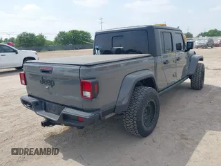 2021 Jeep Gladiator Sport S z VIN 1C6JJTAM1ML607525, wystawiony jako IAAI lot #41941550 z przebiegiem 59 283 mil mil oraz . Historia ofert i sprzedaży dostępna na DreamBid. Obrazek 4.