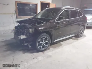 2016 BMW X1 xDrive28i with VIN WBXHT3C33GP886935, listed as a IAAI auction lot 41707367 with 73,201 mi miles. Bid and sale history available at carsss.com. Image 2.