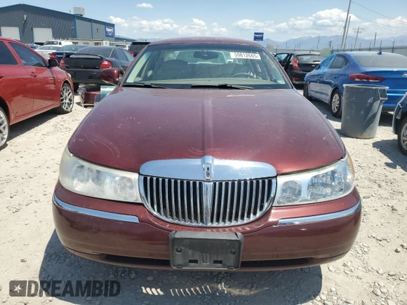 2000 Lincoln Town Car Signature with VIN 1LNHM82W2YY809189, listed as a Copart auction lot 59812665 with 148,236 mi miles and Salvage title. Bid and sale history available at DreamBid. Image 5.