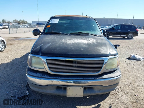 2003 Ford F-150 XLT with VIN 1FTRW07L43KB05221, listed as a IAAI auction lot 41762332 with 226,660 mi miles. Bid and sale history available at carsss.com. Image 12.