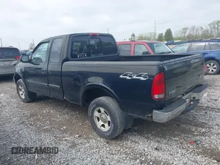 2003 Ford F-150 XL with VIN 2FTRX18W73CA80587, listed as a IAAI auction lot 42119924 with 222,990 mi miles. Bid and sale history available at carsss.com. Image 3.