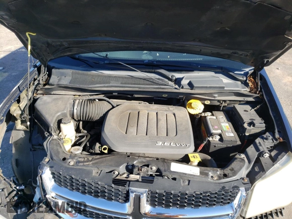 2014 Dodge Grand Caravan SXT z VIN 2C4RDGCG3ER155734, wystawiony jako Copart lot #86000724 z przebiegiem 175 681 mil mil oraz Szkoda całkowita • Salvage title. Historia ofert i sprzedaży dostępna na DreamBid. Obrazek 12.