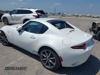 2021 Mazda MX-5 Miata Grand Touring z VIN JM1NDAM75M0450871, wystawiony jako IAAI lot #42060495 z przebiegiem 48 670 mil mil oraz . Historia ofert i sprzedaży dostępna na DreamBid. Obrazek 3.