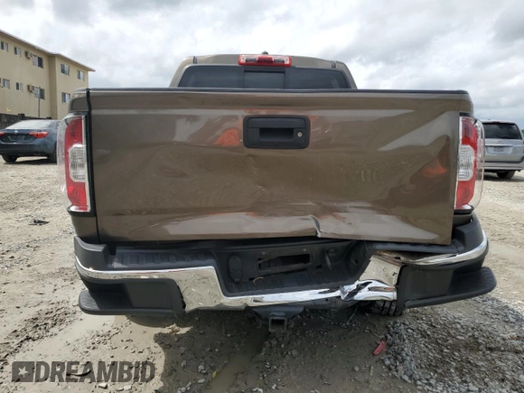 2015 GMC Canyon 4WD SLE with VIN 1GTG6BE38F1263139, listed as a Copart auction lot 75479854 with 124,765 mi miles and Salvage Title. Bid and sale history available at carsss.com. Image 6.