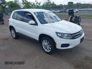 2014 Volkswagen Tiguan S with VIN WVGBV3AX0EW589381, listed as a IAAI auction lot 42186999 with 144,137 mi miles and . Bid and sale history available at DreamBid. Image 1.