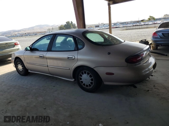 1998 Ford Taurus SE Comfort with VIN 1FAFP53S3WG213045, listed as a Copart auction lot 61653315 with 111,014 mi miles and Salvage title. Bid and sale history available at DreamBid. Image 2.