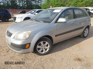 2009 Kia Rio LX with VIN KNADE243896483683, listed as a IAAI auction lot 42061404 with 88,614 mi miles. Bid and sale history available at carsss.com. Image 2.