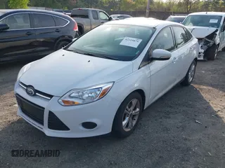 2013 Ford Focus SE z VIN 1FADP3F29DL239824, wystawiony jako IAAI lot #42219875 z przebiegiem 86 699 mil mil oraz . Historia ofert i sprzedaży dostępna na DreamBid. Obrazek 2.