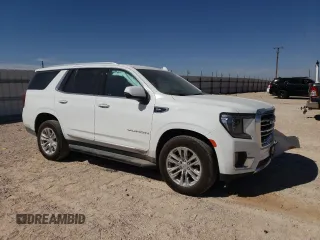 2024 GMC Yukon SLT with VIN 1GKS2BKD6RR237359, listed as a Copart auction lot 77892564 with 9,880 mi miles and Salvage Title. Bid and sale history available at carsss.com. Image 4.