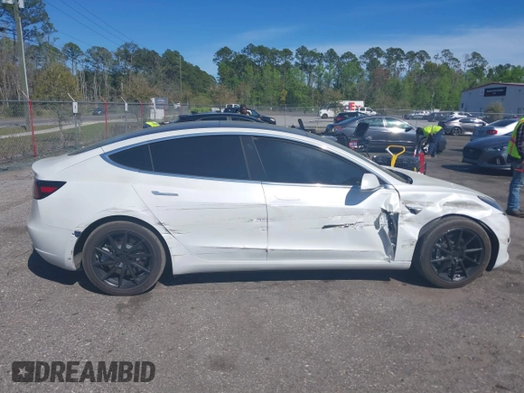 2019 Tesla Model 3 Mid Range with VIN 5YJ3E1EA7KF425127, listed as a IAAI auction lot 41886436 with 87,236 mi miles and . Bid and sale history available at carsss.com. Image 13.