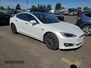 2019 Tesla Model S 100D with VIN 5YJSA1E41KF330631, listed as a Copart auction lot 55360295 with 52,245 mi miles and Salvage title. Bid and sale history available at DreamBid. Image 4.