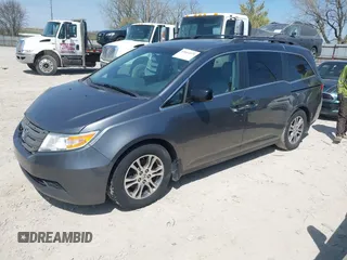 2012 Honda Odyssey EX-L with VIN 5FNRL5H69CB047425, listed as a IAAI auction lot 42064979 with 242,409 mi miles and . Bid and sale history available at carsss.com. Image 21.