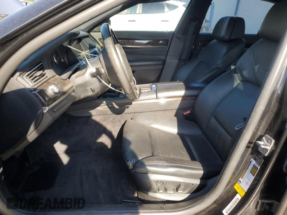 2011 BMW 7 Series 740i with VIN WBAKA4C52BC612977, listed as a Copart auction lot 52582575 with 157,813 mi miles and Salvage Title. Bid and sale history available at carsss.com. Image 7.