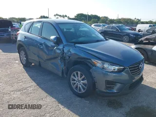 2016 Mazda CX-5 Sport with VIN JM3KE2BY8G0864983, listed as a IAAI auction lot 42072385 with 141,104 mi miles. Bid and sale history available at carsss.com. Image 1.