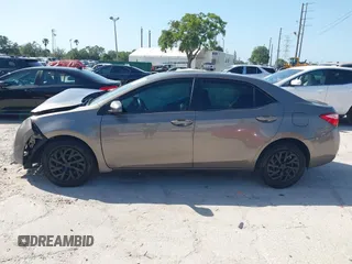 2019 Toyota Corolla L with VIN 5YFBURHE7KP878972, listed as a IAAI auction lot 42000888 with 201,612 mi miles. Bid and sale history available at carsss.com. Image 14.