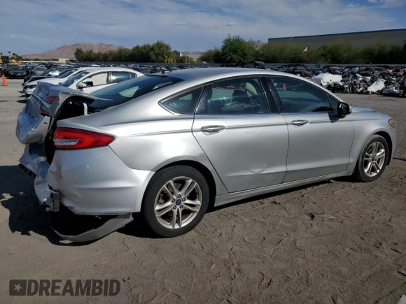 2018 Ford Fusion SE z VIN 3FA6P0LU7JR139974, wystawiony jako Copart lot #69819394 z przebiegiem 164 123 mil mil oraz Szkoda całkowita • Salvage title. Historia ofert i sprzedaży dostępna na DreamBid. Obrazek 3.