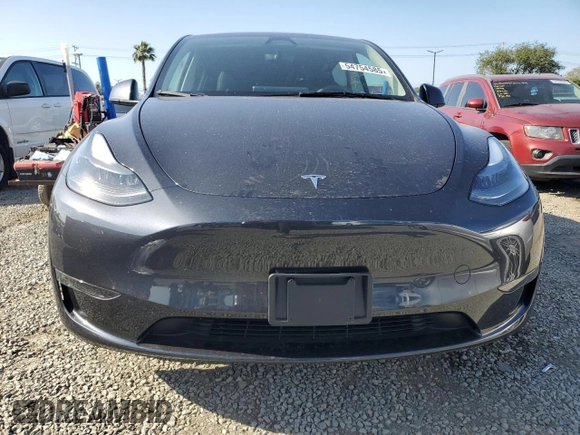 2024 Tesla Model Y z VIN 7SAYGDED2RF114150, wystawiony jako Copart lot #54754585 z przebiegiem 7 924 mil mil oraz Szkoda całkowita • Salvage title. Historia ofert i sprzedaży dostępna na DreamBid. Obrazek 5.