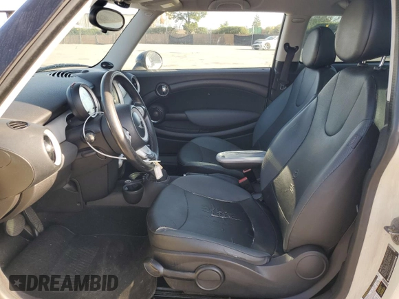 2010 MINI Hardtop with VIN WMWMF3C52ATZ65593, listed as a Copart auction lot 50107445 with 105,389 mi miles and Salvage title. Bid and sale history available at DreamBid. Image 7.