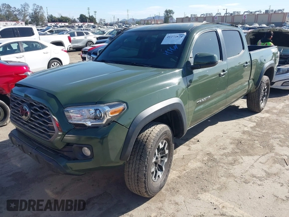 2021 Toyota Tacoma 4WD SR5 with VIN 3TMDZ5BN2MM101265, listed as a IAAI auction lot 41272874 with 51,989 mi miles. Bid and sale history available at carsss.com. Image 2.