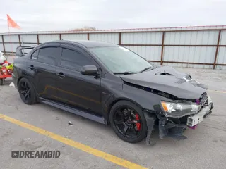 2013 Mitsubishi Lancer Evolution GSR with VIN JA32W8FV8DU012080, listed as a IAAI auction lot 41379744 with 95,070 mi miles. Bid and sale history available at carsss.com. Image 1.