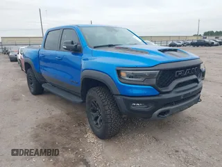 2021 Ram 1500 TRX with VIN 1C6SRFU91MN685295, listed as a IAAI auction lot 41311163 with 33,352 mi miles and . Bid and sale history available at DreamBid. Image 1.