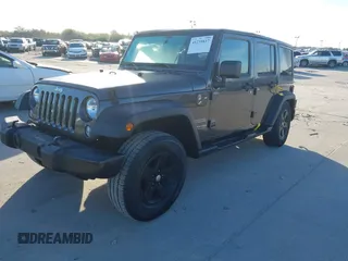 2018 Jeep Wrangler JK Unlimited Sport S with VIN 1C4BJWDG3JL900973, listed as a IAAI auction lot 41239817 with 50,952 mi miles. Bid and sale history available at carsss.com. Image 2.