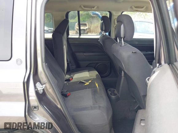 2014 Jeep Patriot Latitude with VIN 1C4NJRFB3ED847997, listed as a IAAI auction lot 42109140 with 121,299 mi miles and . Bid and sale history available at carsss.com. Image 8.