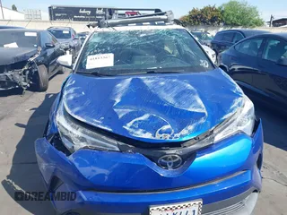 2019 Toyota C-HR XLE with VIN JTNKHMBX5K1043079, listed as a IAAI auction lot 41813367 with 77,879 mi miles and . Bid and sale history available at DreamBid. Image 13.