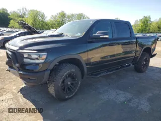2019 Ram 1500 Rebel z VIN 1C6SRFLT5KN811457, wystawiony jako Copart lot #57034285 z przebiegiem 84 077 mil mil oraz Szkoda całkowita • Salvage title. Historia ofert i sprzedaży dostępna na DreamBid. Obrazek 1.