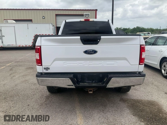 2019 Ford F-150 XL with VIN 1FTFX1E54KKD11857, listed as a IAAI auction lot 42141854 with 105,585 mi miles. Bid and sale history available at carsss.com. Image 1.