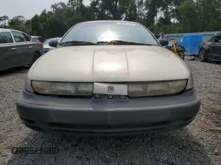 1999 Saturn SL z VIN 1G8ZH5283XZ349797, wystawiony jako Copart lot #58221955 z przebiegiem 148 506 mil mil oraz Nie do naprawy. Historia ofert i sprzedaży dostępna na DreamBid. Obrazek 5.