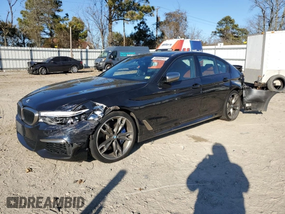 2020 BMW 5 Series M550i xDrive with VIN WBAJS7C0XLCE44248, listed as a Copart auction lot 48660045 with 73,949 mi miles and Salvage title. Bid and sale history available at DreamBid. Image 1.
