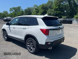 2023 Honda Passport EX-L with VIN 5FNYF8H55PB011474, listed as a Copart auction lot 62492595 with 18,327 mi miles and Salvage title. Bid and sale history available at DreamBid. Image 3.