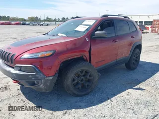 2015 Jeep Cherokee Trailhawk with VIN 1C4PJMBS1FW640483, listed as a IAAI auction lot 41883688 with 103,589 mi miles. Bid and sale history available at carsss.com. Image 2.