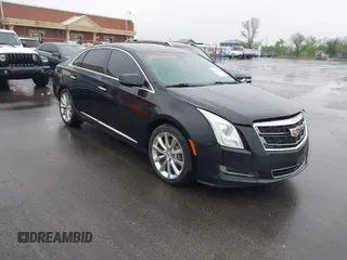 2016 Cadillac XTS Livery Package with VIN 2G61U5S38G9136327, listed as a IAAI auction lot 41935174 with 136,672 mi miles. Bid and sale history available at carsss.com. Image 1.