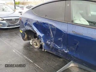 2022 Tesla Model Y Long Range with VIN 7SAYGDEE7NF409294, listed as a IAAI auction lot 41845261 with 73,116 mi miles and . Bid and sale history available at DreamBid. Image 11.