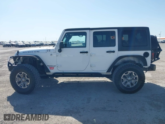 2014 Jeep Wrangler Unlimited Rubicon with VIN 1C4BJWFG1EL167423, listed as a IAAI auction lot 41861109 with 104,669 mi miles. Bid and sale history available at carsss.com. Image 14.
