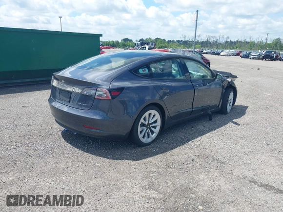 2022 Tesla Model 3 Long Range z VIN 5YJ3E1EB0NF124664, wystawiony jako IAAI lot #34246337 z przebiegiem Nie podano mil oraz . Historia ofert i sprzedaży dostępna na DreamBid. Obrazek 4.