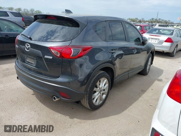 2014 Mazda CX-5 Grand Touring with VIN JM3KE2DY0E0354220, listed as a IAAI auction lot 41885502 with 168,901 mi miles. Bid and sale history available at carsss.com. Image 4.