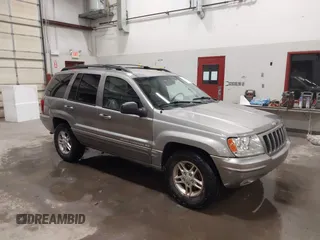 1999 Jeep Grand Cherokee Limited with VIN 1J4GW68N7XC752314, listed as a IAAI auction lot 41776905 with 228,023 mi miles. Bid and sale history available at carsss.com. Image 1.