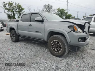 2020 Toyota Tacoma SR5 with VIN 3TMAZ5CNXLM121344, listed as a Copart auction lot 59393395 with 69,902 mi miles and Salvage title. Bid and sale history available at DreamBid. Image 4.
