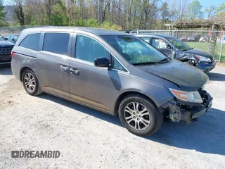 2011 Honda Odyssey EX-L with VIN 5FNRL5H60BB072101, listed as a IAAI auction lot 42002097 with 243,607 mi miles and . Bid and sale history available at carsss.com. Image 1.