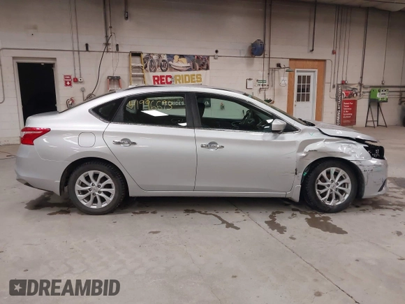 2019 Nissan Sentra S z VIN 3N1AB7AP7KY440764, wystawiony jako IAAI lot #41996693 z przebiegiem 34 594 mil mil oraz . Historia ofert i sprzedaży dostępna na DreamBid. Obrazek 14.