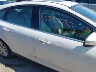 2018 Ford Focus Titanium with VIN 1FADP3N24JL279449, listed as a IAAI auction lot 42297780 with 144,479 mi miles and . Bid and sale history available at DreamBid. Image 13.