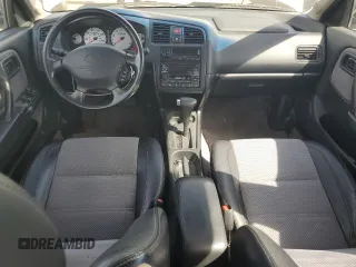 2002 Infiniti G20 Luxury z VIN JNKCP11A42T506808, wystawiony jako Copart lot #75259494 z przebiegiem 69 426 mil mil oraz Szkody całkowita. Historia ofert i sprzedaży dostępna na DreamBid. Obrazek 8.